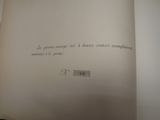 an open book with writing on it on a table