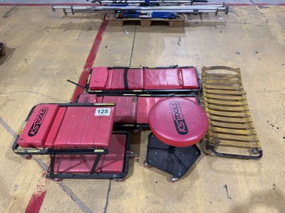 many red luggages sitting on the floor in a warehouse