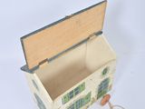 a small wooden box with a picture of a house inside of it