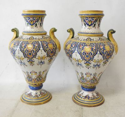 two vases that are sitting next to each other on a table