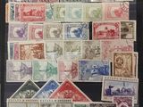 a collection of stamps from around the world, including a picture of a man and a woman