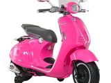 a pink scooter that is parked on a white surface