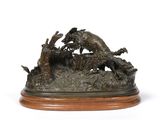a bronze statue of a dog and a cat on a wooden base