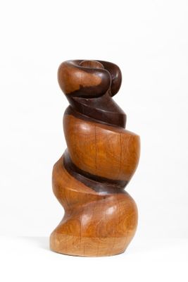 wooden sculpture of a spiral design on a white background