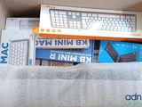 a box with a keyboard, mouse, and other electronic items in it