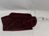 a brown blanket on a white sheet with a hair dryer