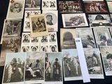 a lot of old photographs on the table
