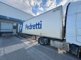 a semi truck that is parked in front of a building