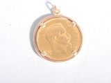 a gold coin with a picture of a man on it