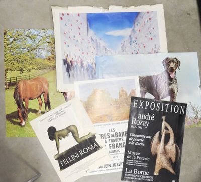 a bunch of books on a table with pictures on it