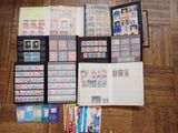 a lot of stamps on a table with a picture frame