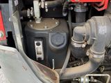 a close up view of the engine of a red truck