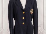 navy blue blazer with gold buttons on a mannequin base