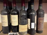 many bottles of wine on a shelf in a store