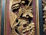 a wooden carving of a dragon on the wall