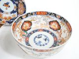 a bowl and a plate sitting on a table