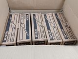 a cardboard box filled with boxes of cigarettes on a table