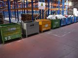 many bins in a large warehouse filled with lots of stuff