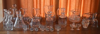 a lot of glass vases sitting on a table