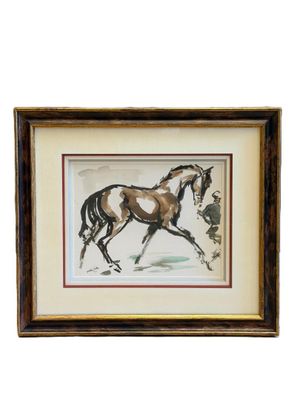 tableau représentant un cheval galopant dans la neige, dans un cadre en bois