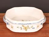 an image of a white bowl with blue and yellow flowers on it