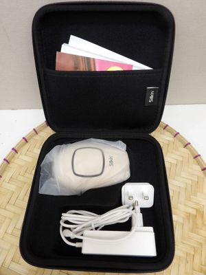 a black case with a remote and a charger in it