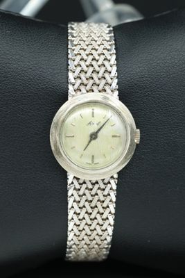 an image of a wrist watch with a chain around it