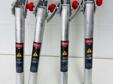 four different types of pipe cutters are lined up on a counter