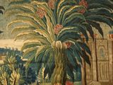 an image of a tapestry with a palm tree and a building in the background