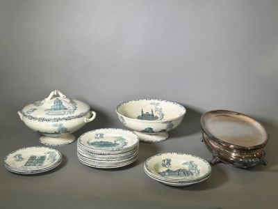 several pieces of blue and white china sitting on top of a table
