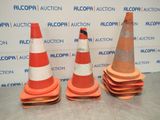three orange and white traffic cones sitting on top of a table