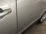 a close up of a car door handle with a sticker on it