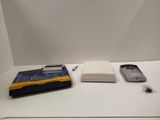a cell phone, a book, and a cell phone sitting on a table