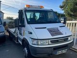a white truck that is parked next to a fence