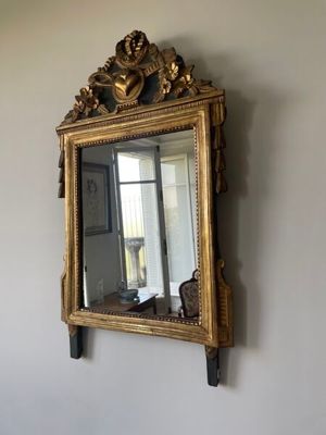 a mirror hanging on the wall in a room