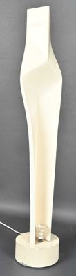 a white mannequin on a stand with a wire