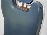 a blue chair that has a seat on it