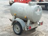 a trailer with a tank attached to it in a parking lot