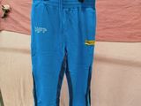 a pair of blue pants hanging on a clothes rack