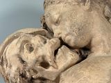 a statue of a woman holding a baby in her arms