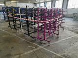 many carts that are sitting in a warehouse