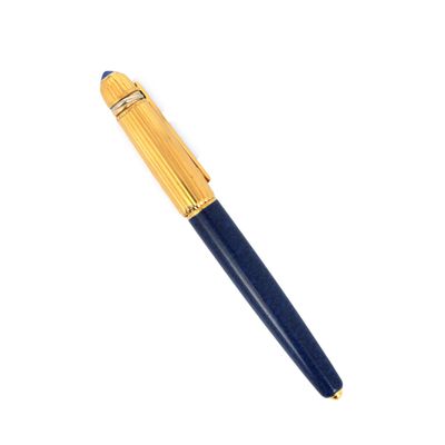 a close up of a pen on a white surface with a white background