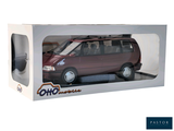 a toy car in a box that is sitting on a table