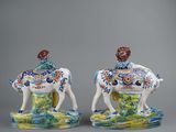pair of porcelain figurines of a man on a horse and a woman on a horse