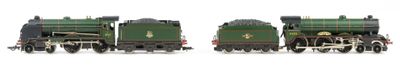 two trains that are sitting side by side on a white surface