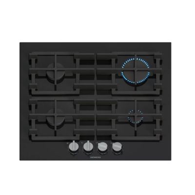 un gros plan sur une plaque de cuisson noire à quatre feux et boutons
