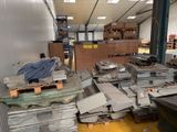a large pile of metal items in a warehouse