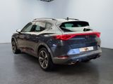 the rear end of a grey car parked in a showroom