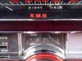 a close up of a car dashboard with a clock on it