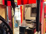 a machine that is sitting in a room with red curtains